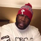Umar Johnson and a skullcap with a ball on the topYoutube screenshot